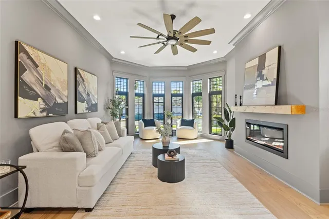 a kitchen with a dining table chairs sink and stove