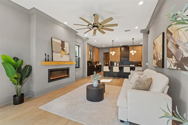 a kitchen with granite countertop a sink a center island stainless steel appliances and cabinets