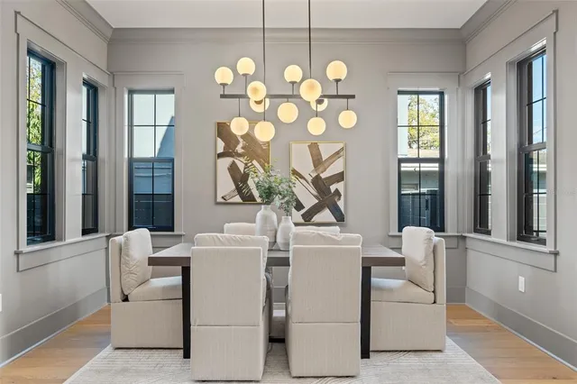 a living room with furniture and a ceiling fan