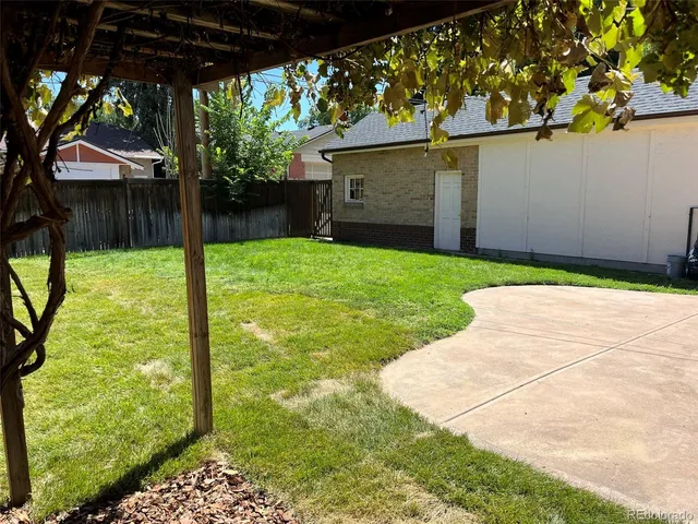 a backyard of a house with seating space