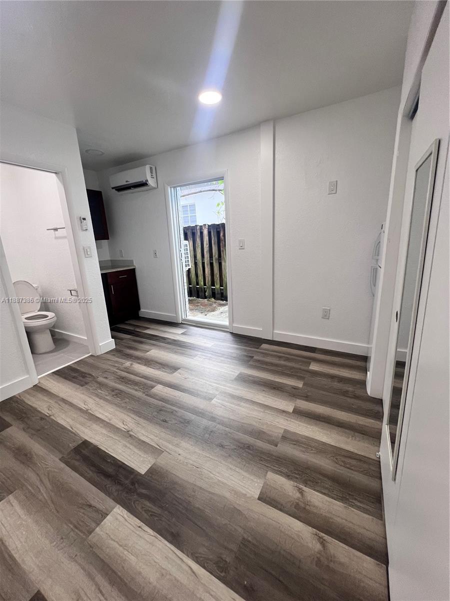 14763 Southwest 173rd Terrace Miami, FL 33187 - Photo 12 of 22 a view of a livingroom with wooden floor and staircase