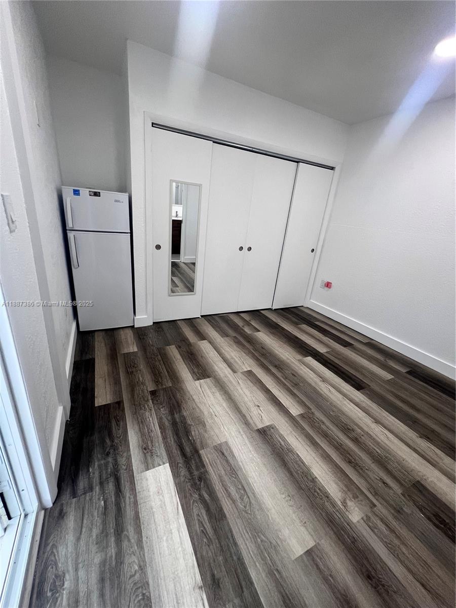 14763 Southwest 173rd Terrace Miami, FL 33187 - Photo 13 of 22 a view of a room with wooden floor