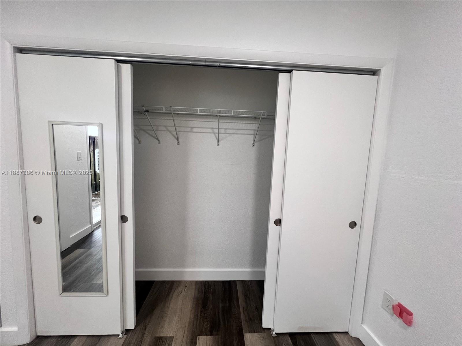 14763 Southwest 173rd Terrace Miami, FL 33187 - Photo 14 of 22 a view of closet with wooden floor