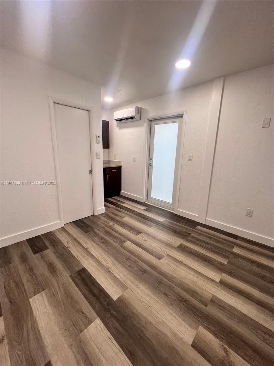 14763 Southwest 173rd Terrace Miami, FL 33187 - Photo 17 of 22 a view of empty room with wooden floor