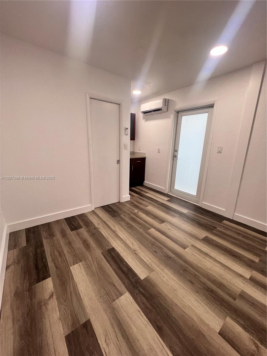 14763 Southwest 173rd Terrace Miami, FL 33187 - Photo 18 of 22 a view of a room with wooden floor