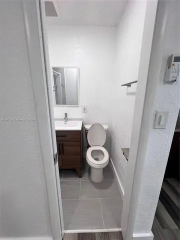 a bathroom with a toilet and a sink