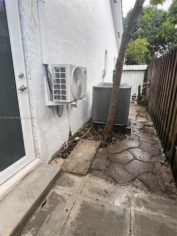 a view of a two chairs in a patio