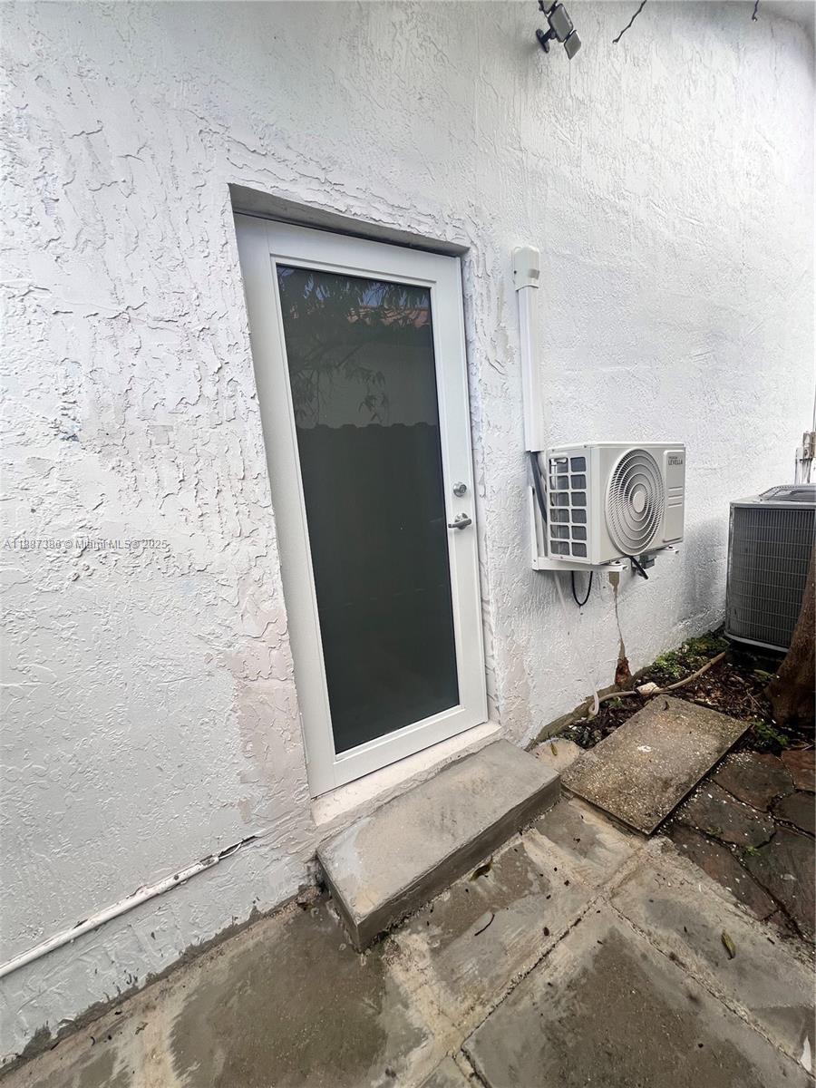 14763 Southwest 173rd Terrace Miami, FL 33187 - Photo 3 of 22 a view of workspace with mirror