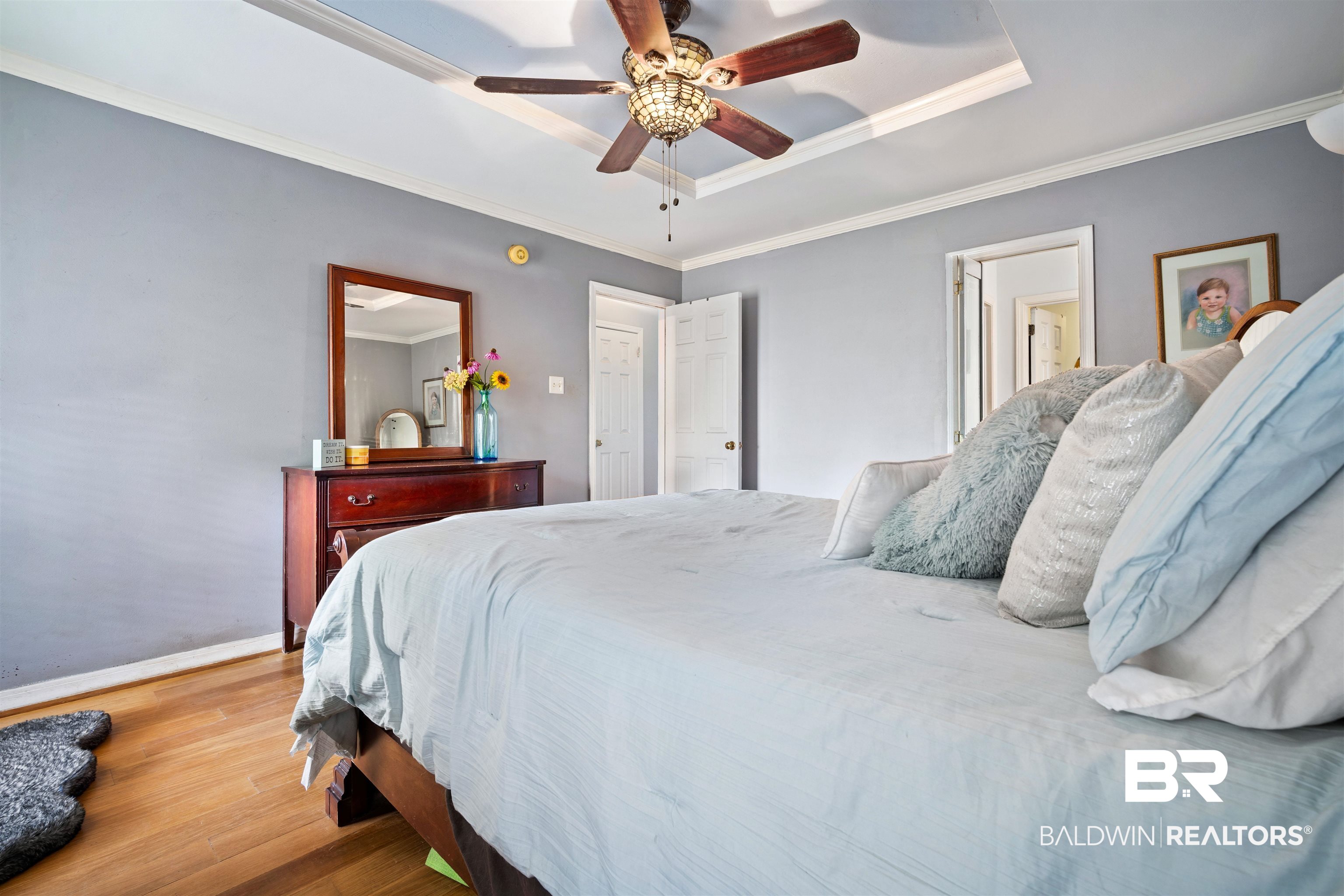 2823 Woodland Road Mobile, AL 36693 - Photo 12 of 29 Bedroom with a raised ceiling, wood finished floors, baseboards, and ornamental molding