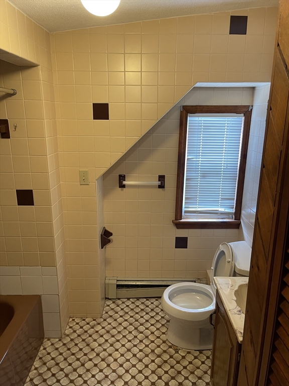 9 Gilmore Street, Unit 3 Everett, MA 02149 - Photo 11 of 11 a bathroom with a toilet and a shower