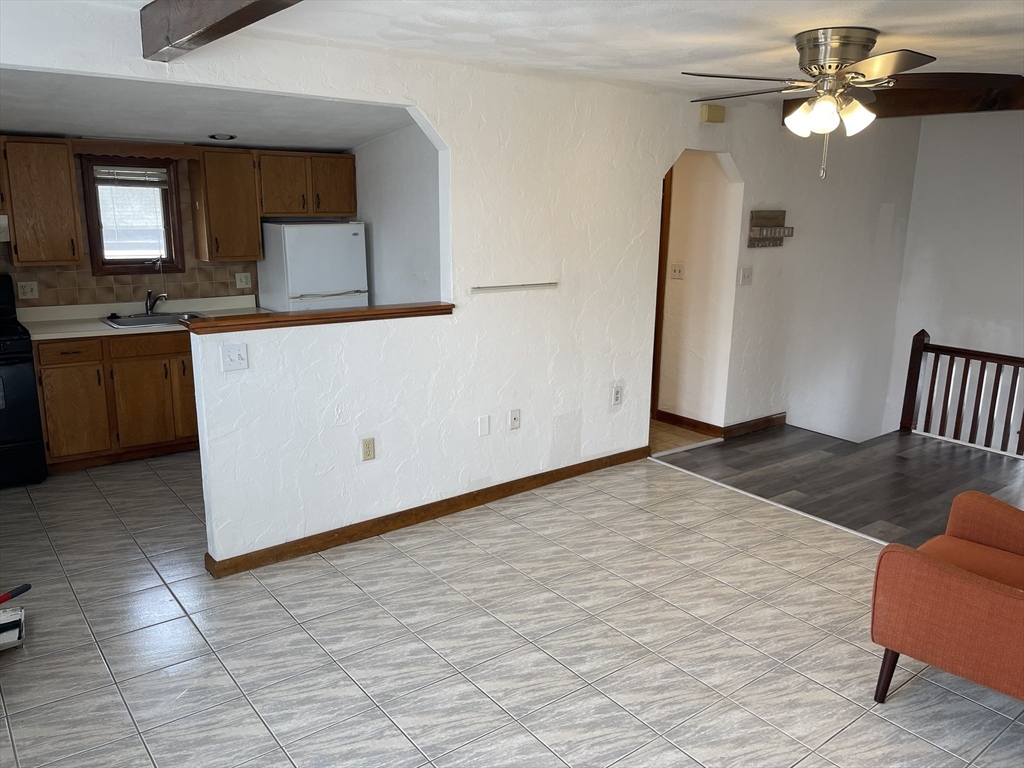 9 Gilmore Street, Unit 3 Everett, MA 02149 - Photo 3 of 11 a view of a kitchen with appliances and cabinets