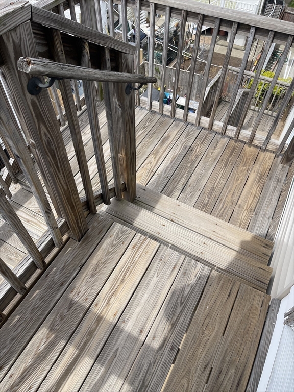 9 Gilmore Street, Unit 3 Everett, MA 02149 - Photo 9 of 11 a view of balcony with wooden floor