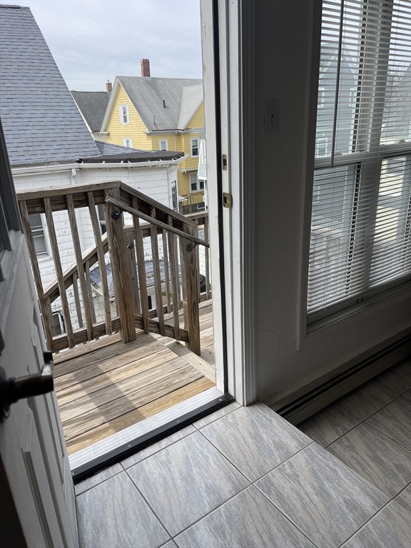 9 Gilmore Street, Unit 3 Everett, MA 02149 - Photo 10 of 11 a view of wooden floor in a balcony
