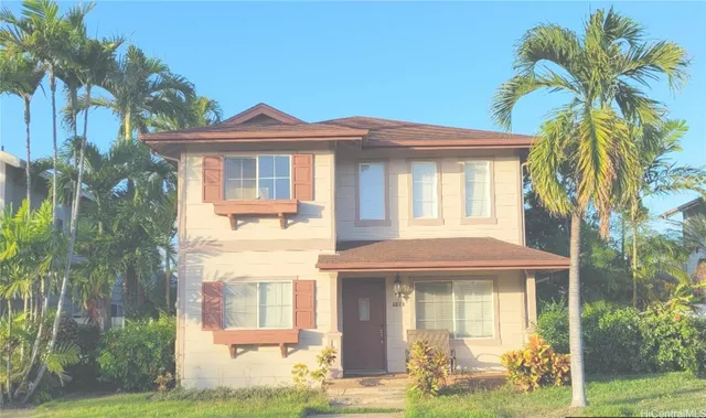a front view of a house with a yard