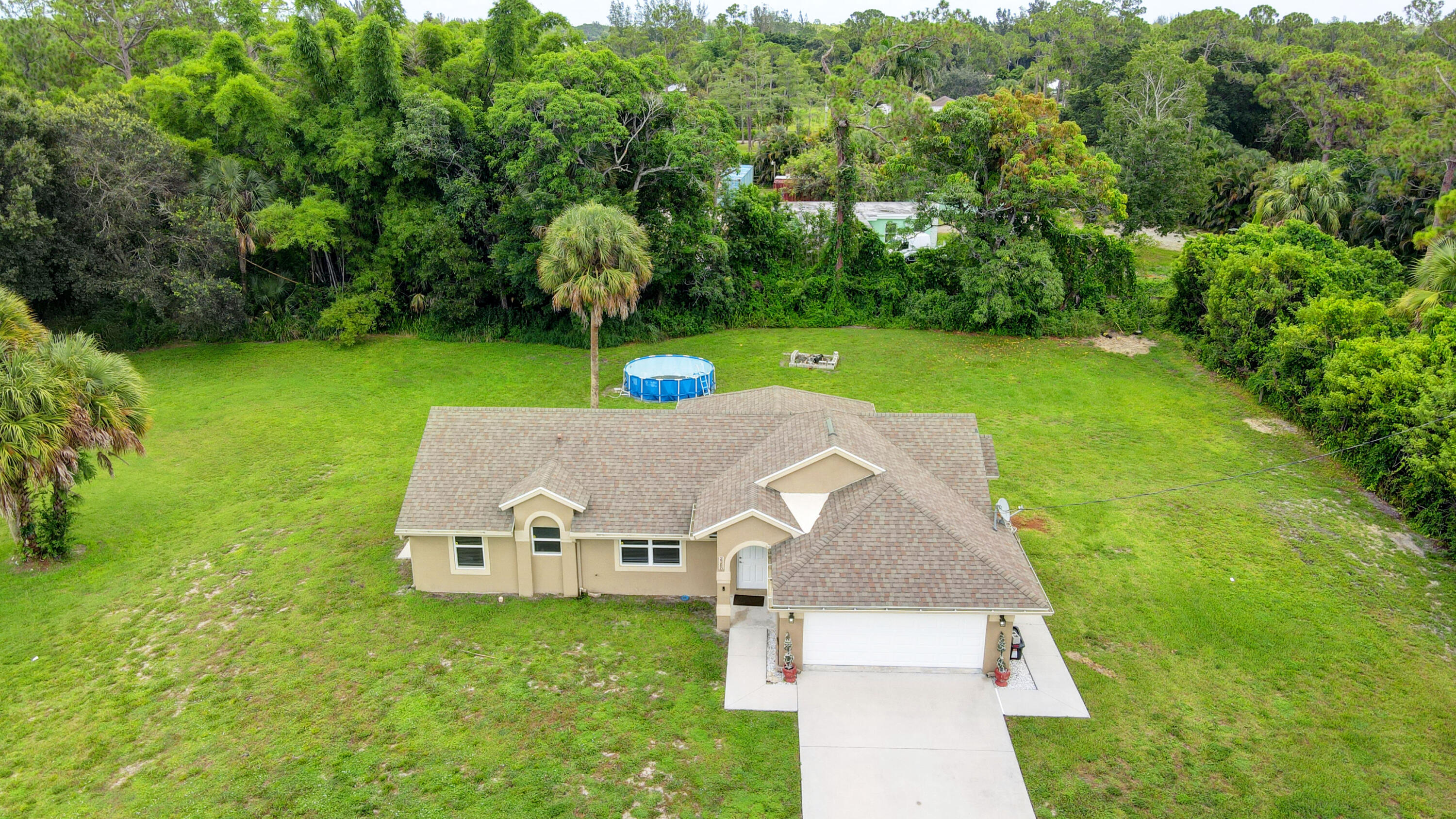 2380 C Road Loxahatchee Groves, FL 33470 - Photo 2 of 43 31_house air (2)