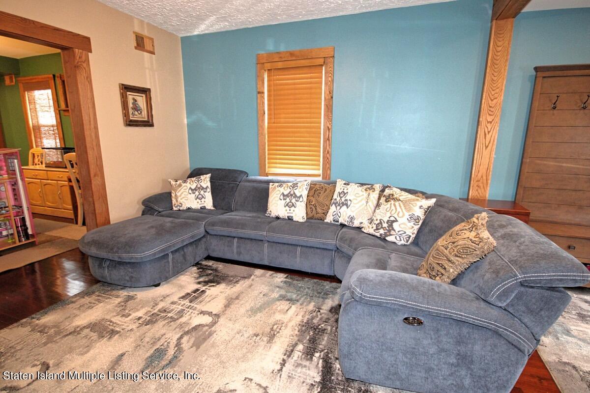 36 Cornell Street Staten Island, NY 10302 - Photo 11 of 31 a living room with furniture and a couch