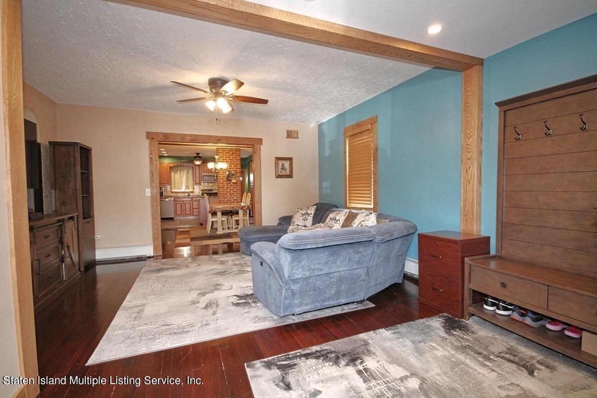 36 Cornell Street Staten Island, NY 10302 - Photo 12 of 31 a living room with furniture and a fireplace