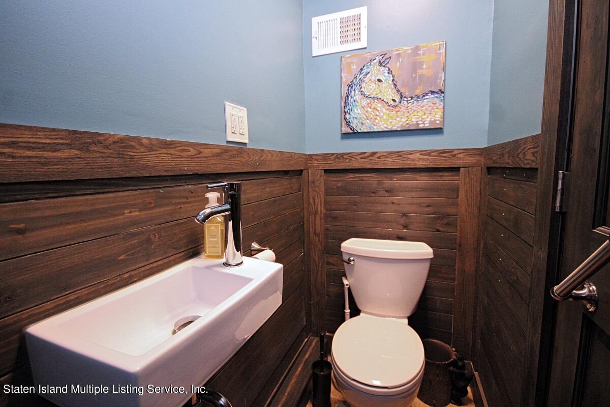 36 Cornell Street Staten Island, NY 10302 - Photo 15 of 31 a bathroom with a toilet and a sink