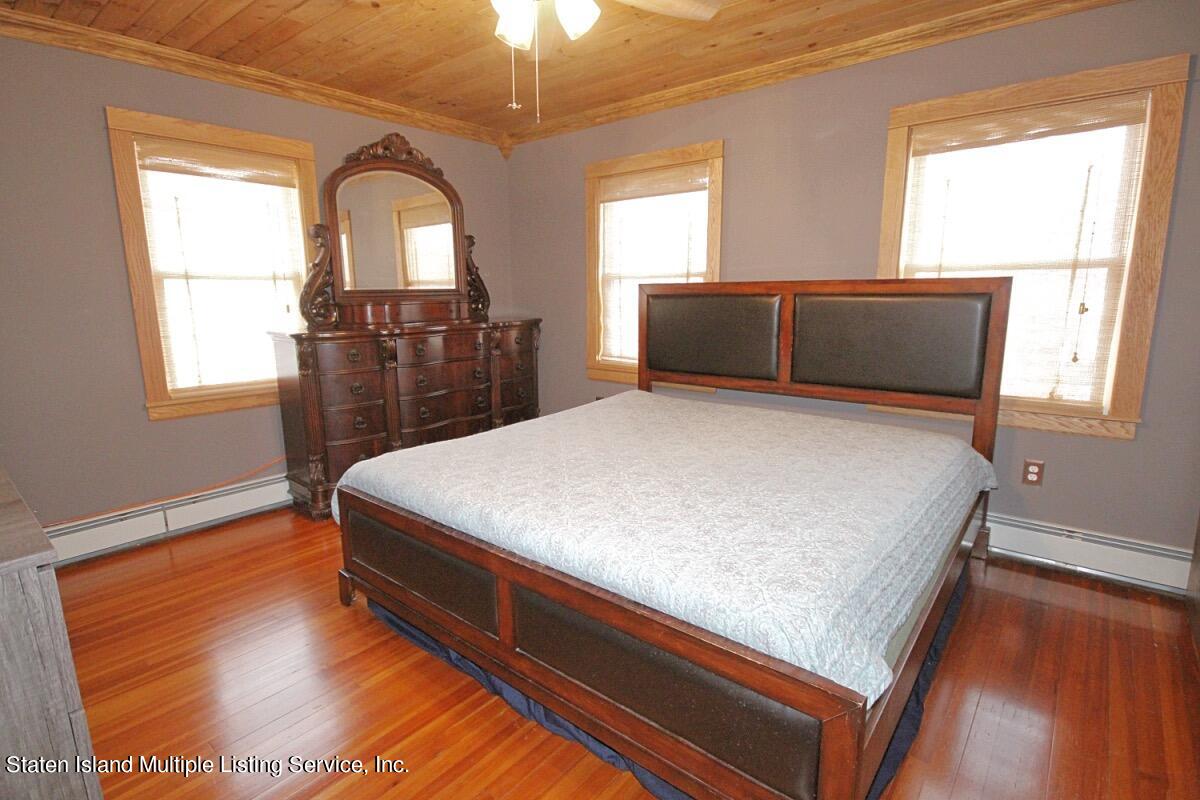 36 Cornell Street Staten Island, NY 10302 - Photo 17 of 31 a bed sitting in a bedroom next to a window