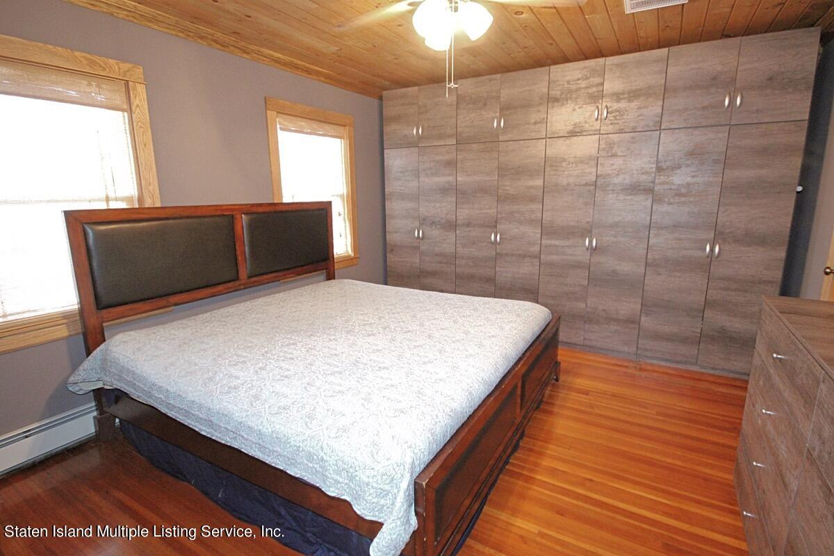 36 Cornell Street Staten Island, NY 10302 - Photo 18 of 31 a room with a bed and a dresser