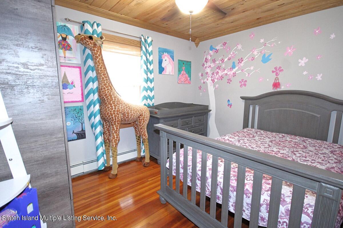 36 Cornell Street Staten Island, NY 10302 - Photo 19 of 31 a bedroom with furniture with wooden floor
