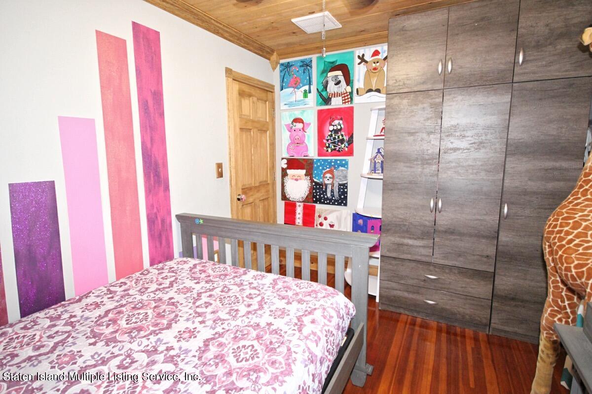 36 Cornell Street Staten Island, NY 10302 - Photo 20 of 31 a bedroom with a bed and a window