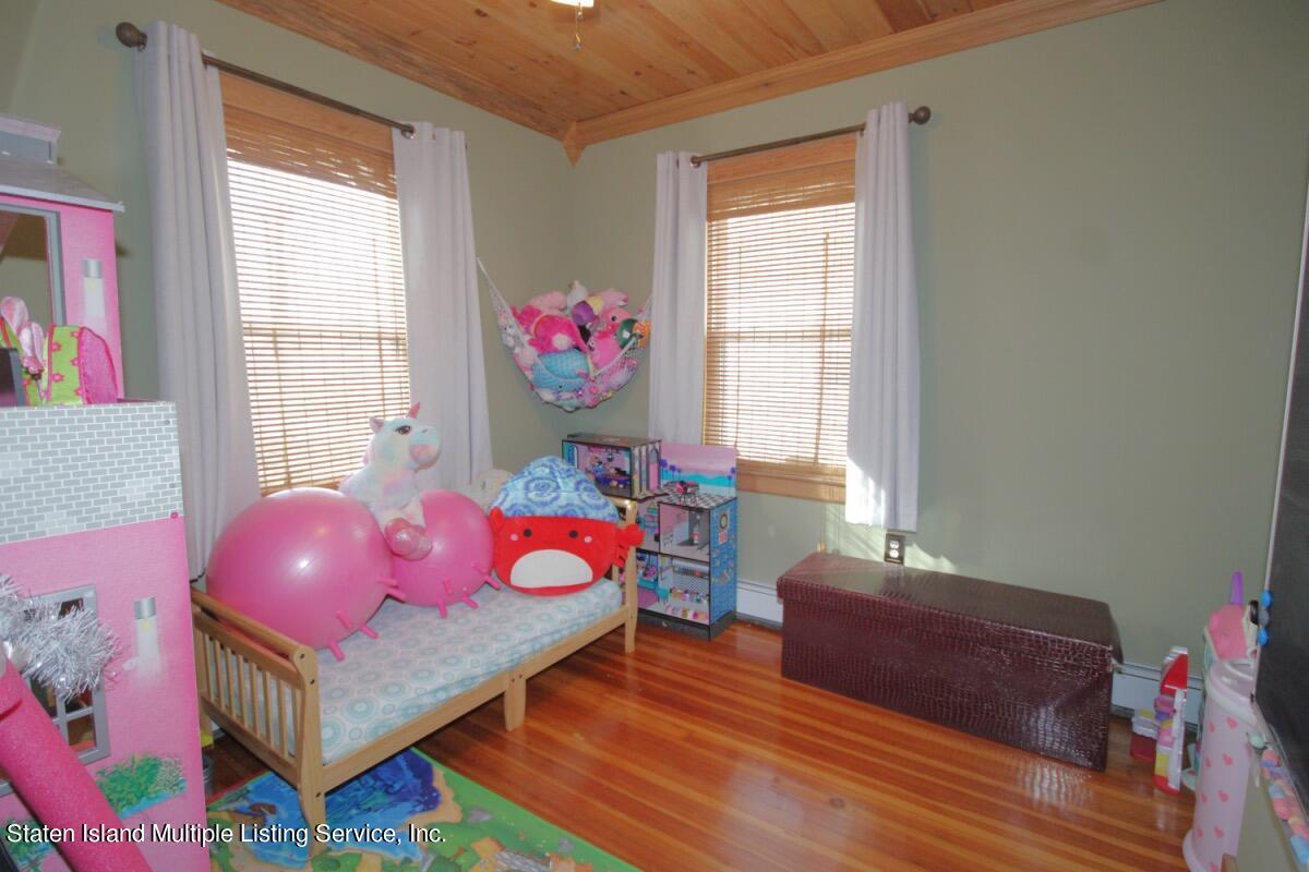 36 Cornell Street Staten Island, NY 10302 - Photo 21 of 31 a bedroom with furniture and a window