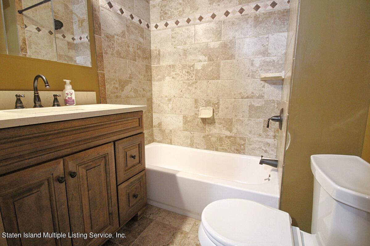 36 Cornell Street Staten Island, NY 10302 - Photo 22 of 31 a bathroom with a sink a toilet and bathtub