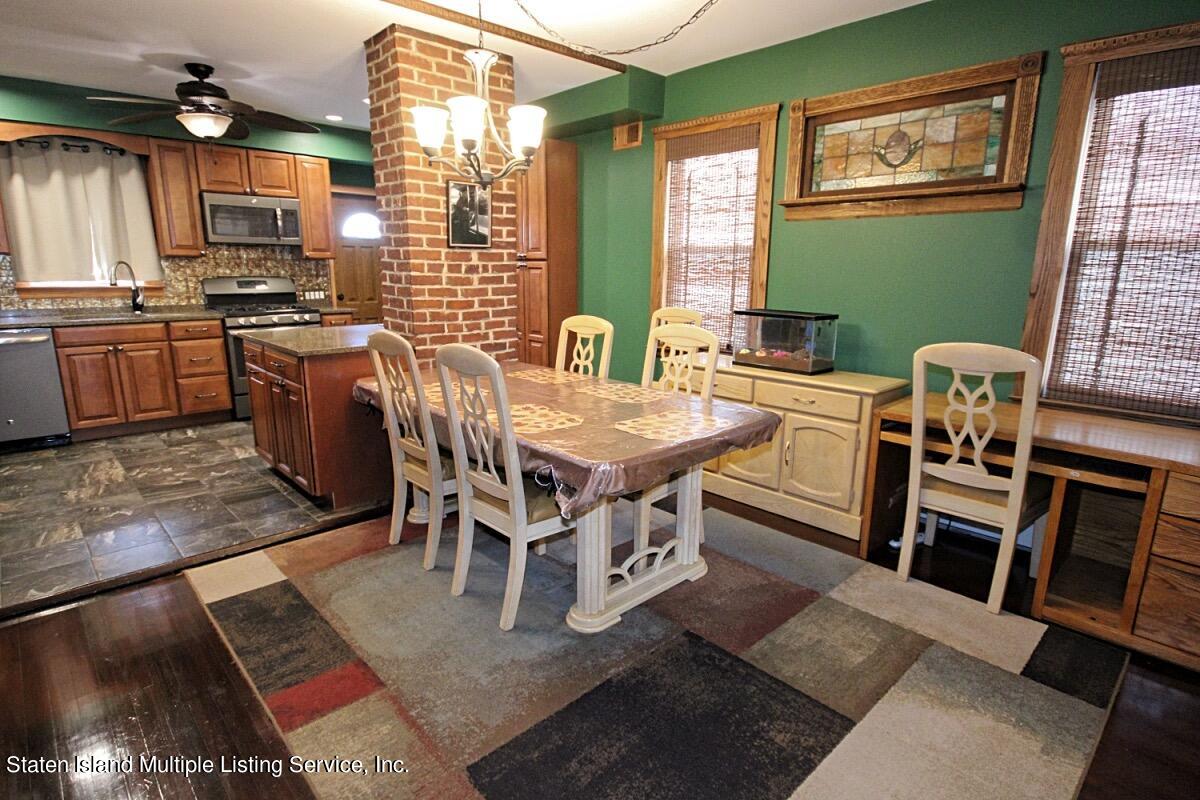 36 Cornell Street Staten Island, NY 10302 - Photo 6 of 31 a view of a dining room with furniture and a window