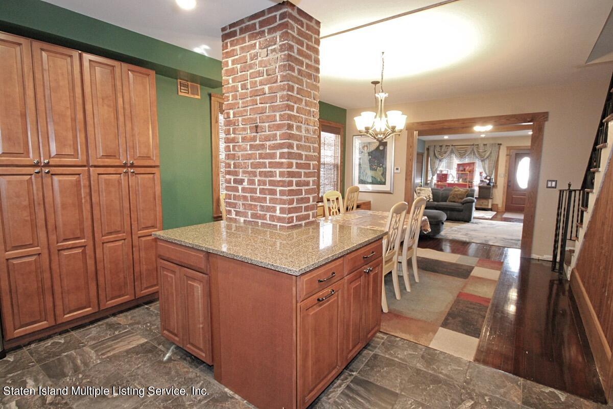 36 Cornell Street Staten Island, NY 10302 - Photo 7 of 31 a kitchen with stainless steel appliances granite countertop a sink and a refrigerator