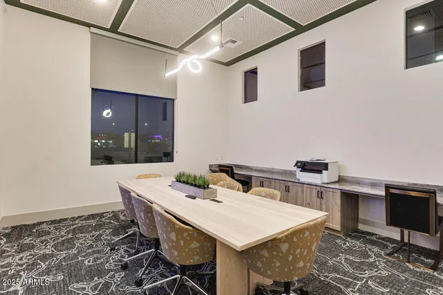 a view of a dinning table and chairs in a room