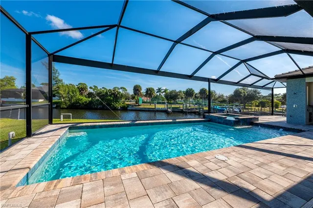a view of a backyard with sitting area