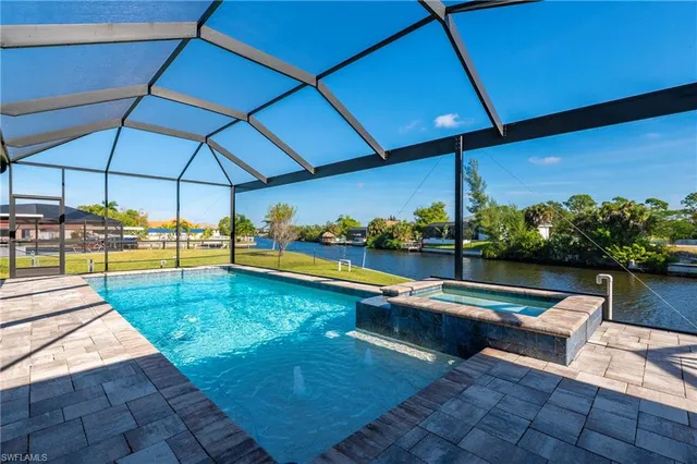 a view of swimming pool with outdoor seating
