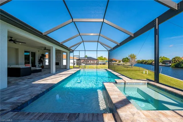 a view of a swimming pool with a patio