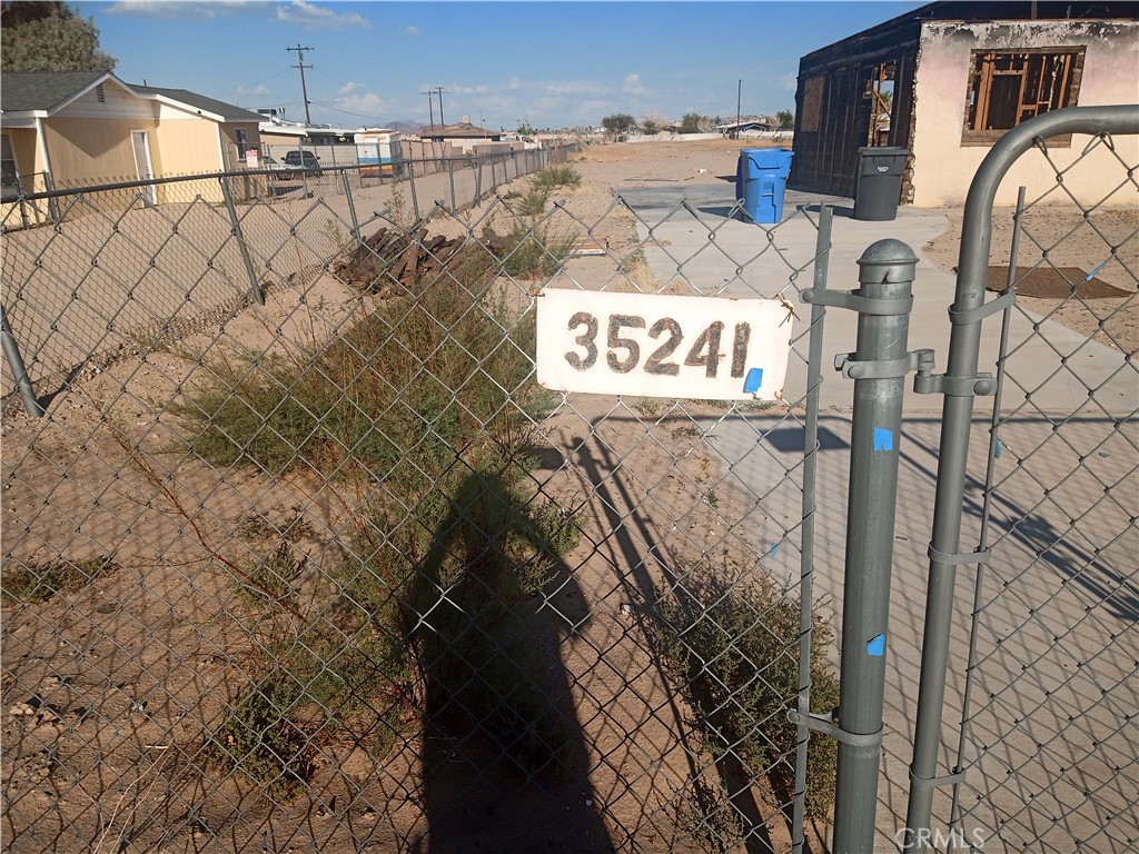 35241 Cedar Road Barstow, CA 92311 - Photo 2 of 3 a signage on a wall next to a building