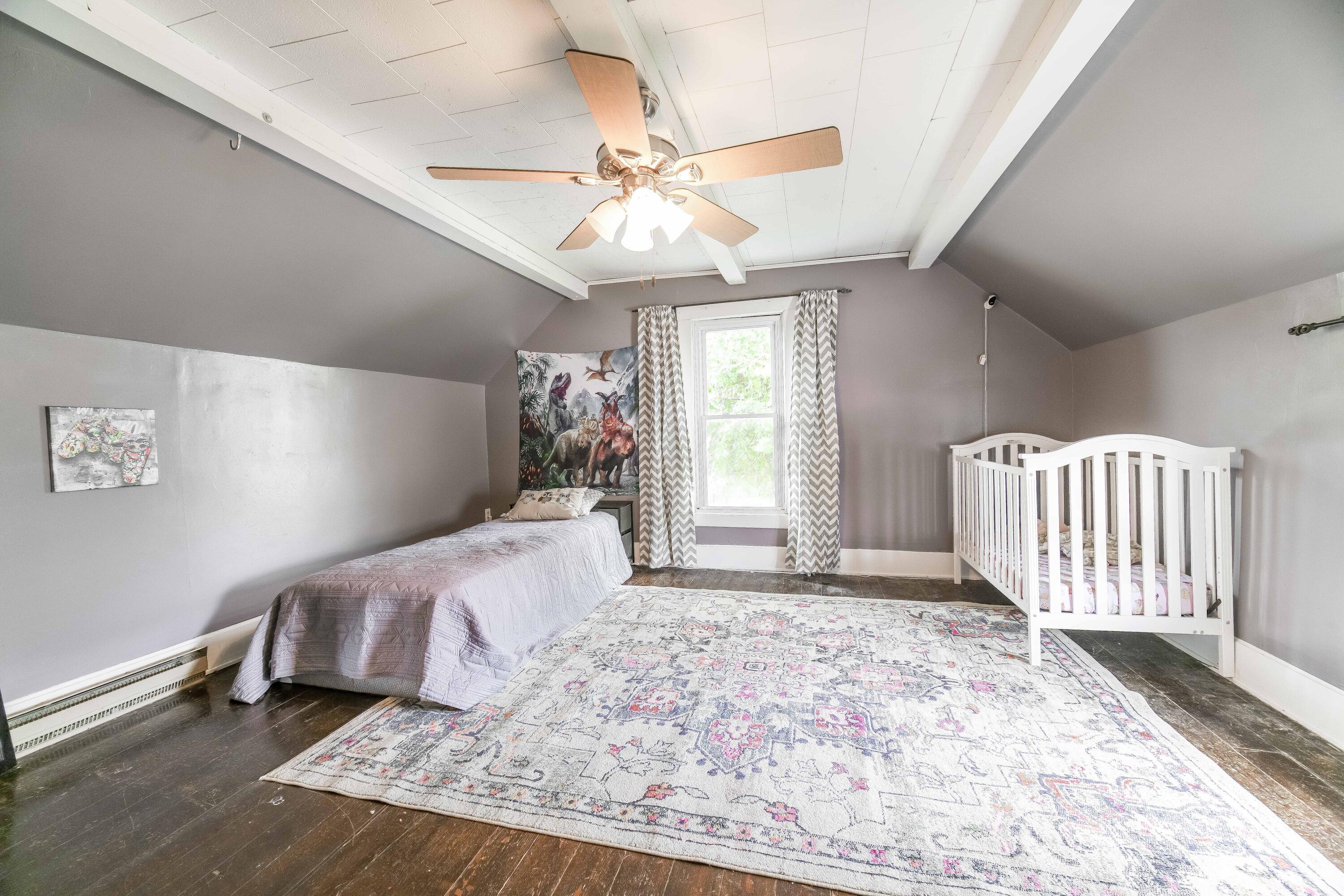 21584 Main Street Raymond, OH 43067 - Photo 23 of 40 Fan and beams on ceiling