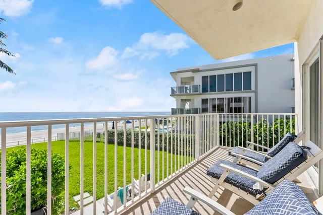 a view of a balcony with a floor to ceiling window