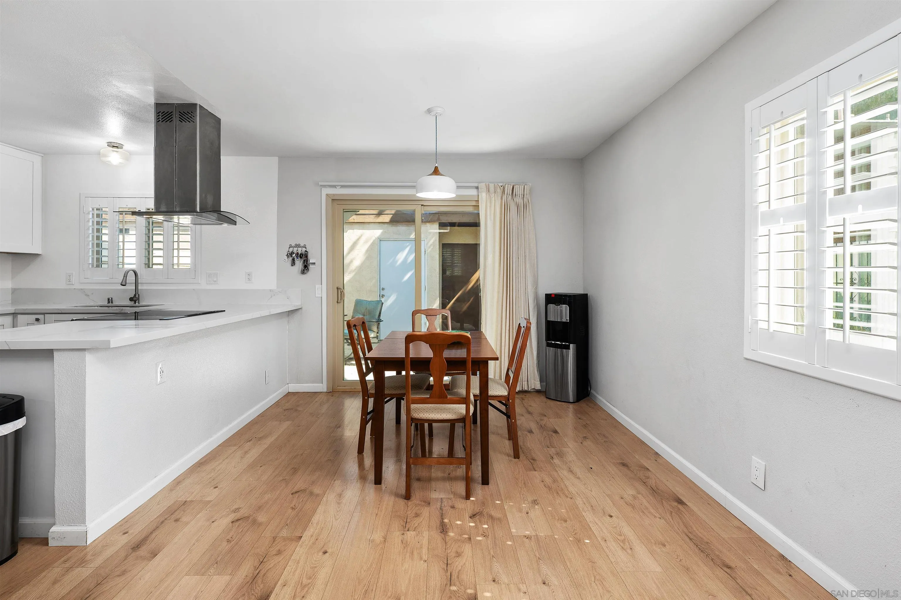 8325 Panorama Ridge Court Spring Valley, CA 91977 - Photo 11 of 39 a dining room with furniture a chandelier and wooden floor