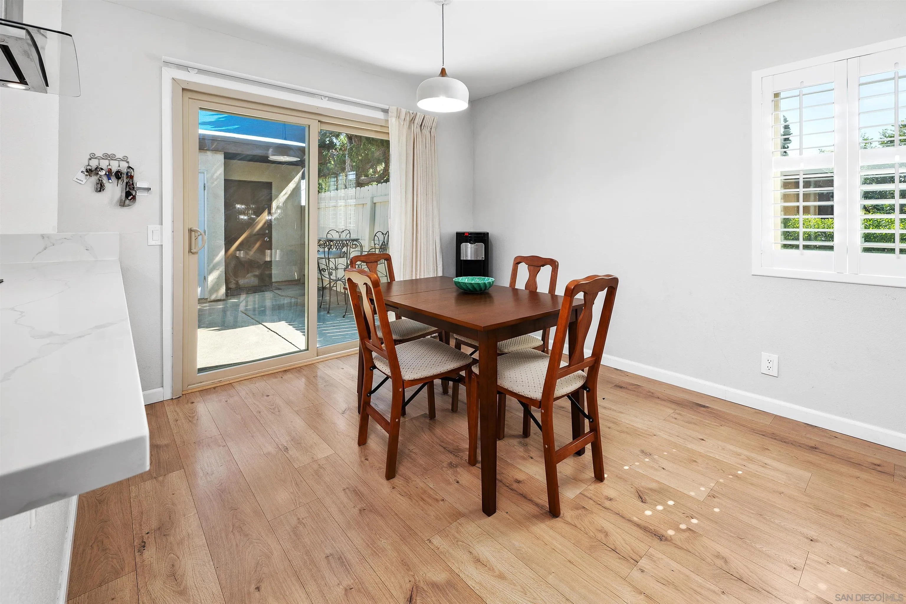 8325 Panorama Ridge Court Spring Valley, CA 91977 - Photo 13 of 39 a view of a dining room with furniture window and wooden floor