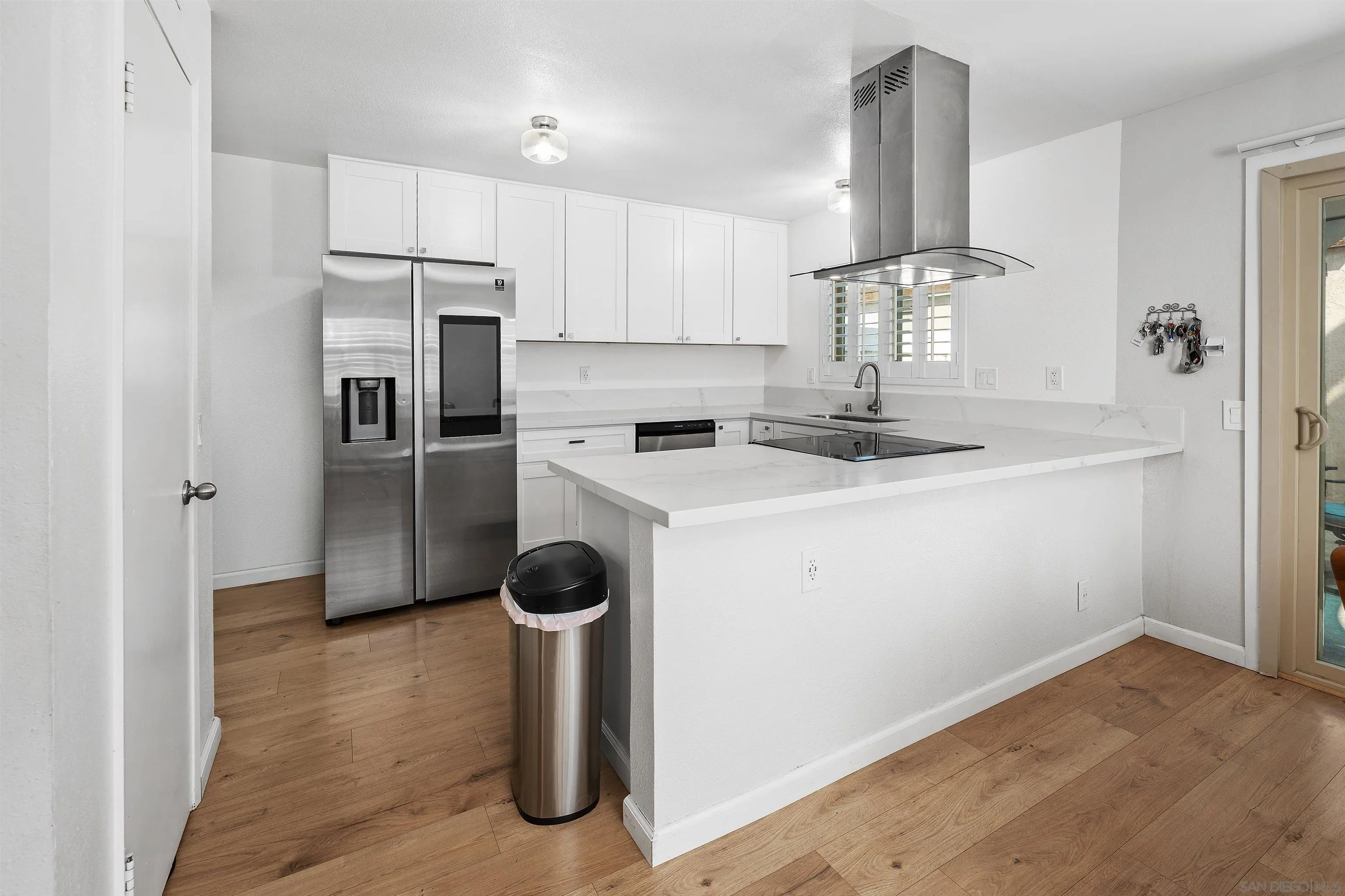 8325 Panorama Ridge Court Spring Valley, CA 91977 - Photo 17 of 39 a kitchen with a sink and refrigerator