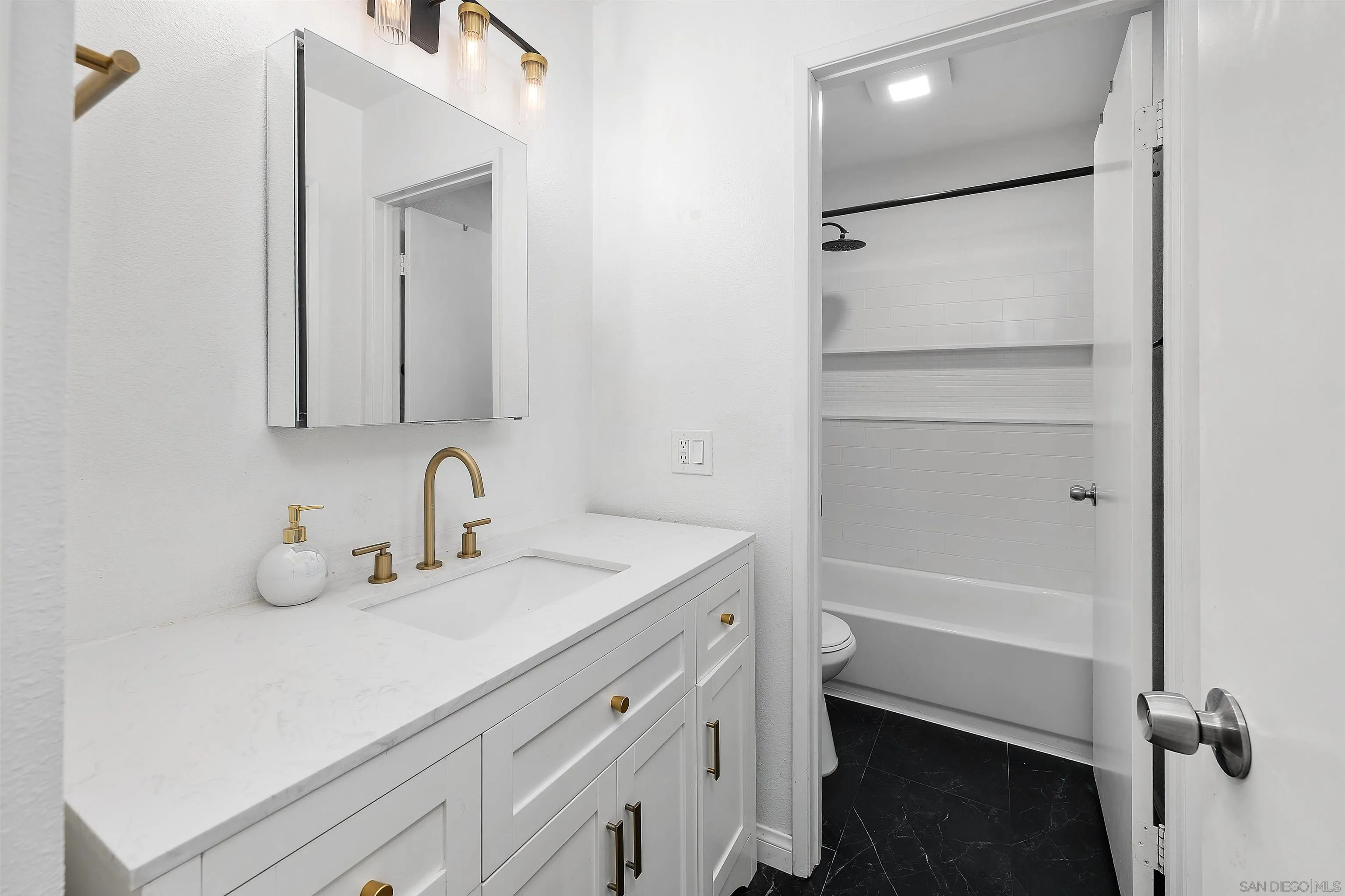 8325 Panorama Ridge Court Spring Valley, CA 91977 - Photo 25 of 39 a bathroom with a sink a toilet and shower