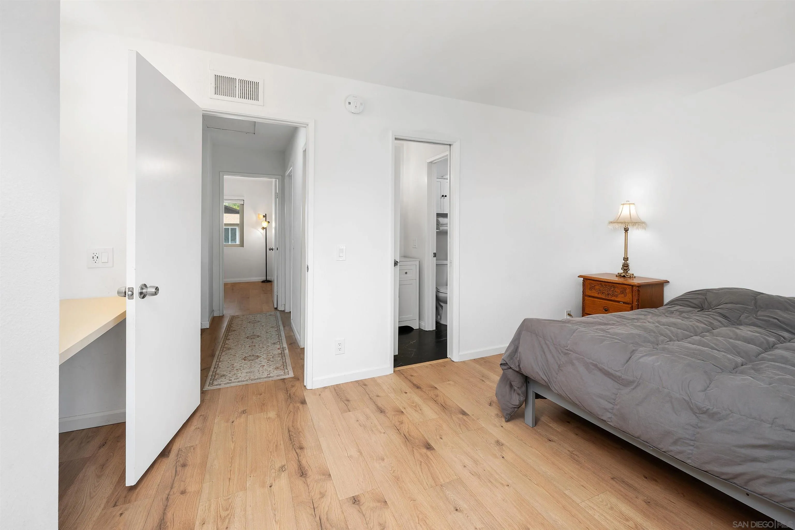 8325 Panorama Ridge Court Spring Valley, CA 91977 - Photo 28 of 39 a bedroom with a bed and a view of bathroom