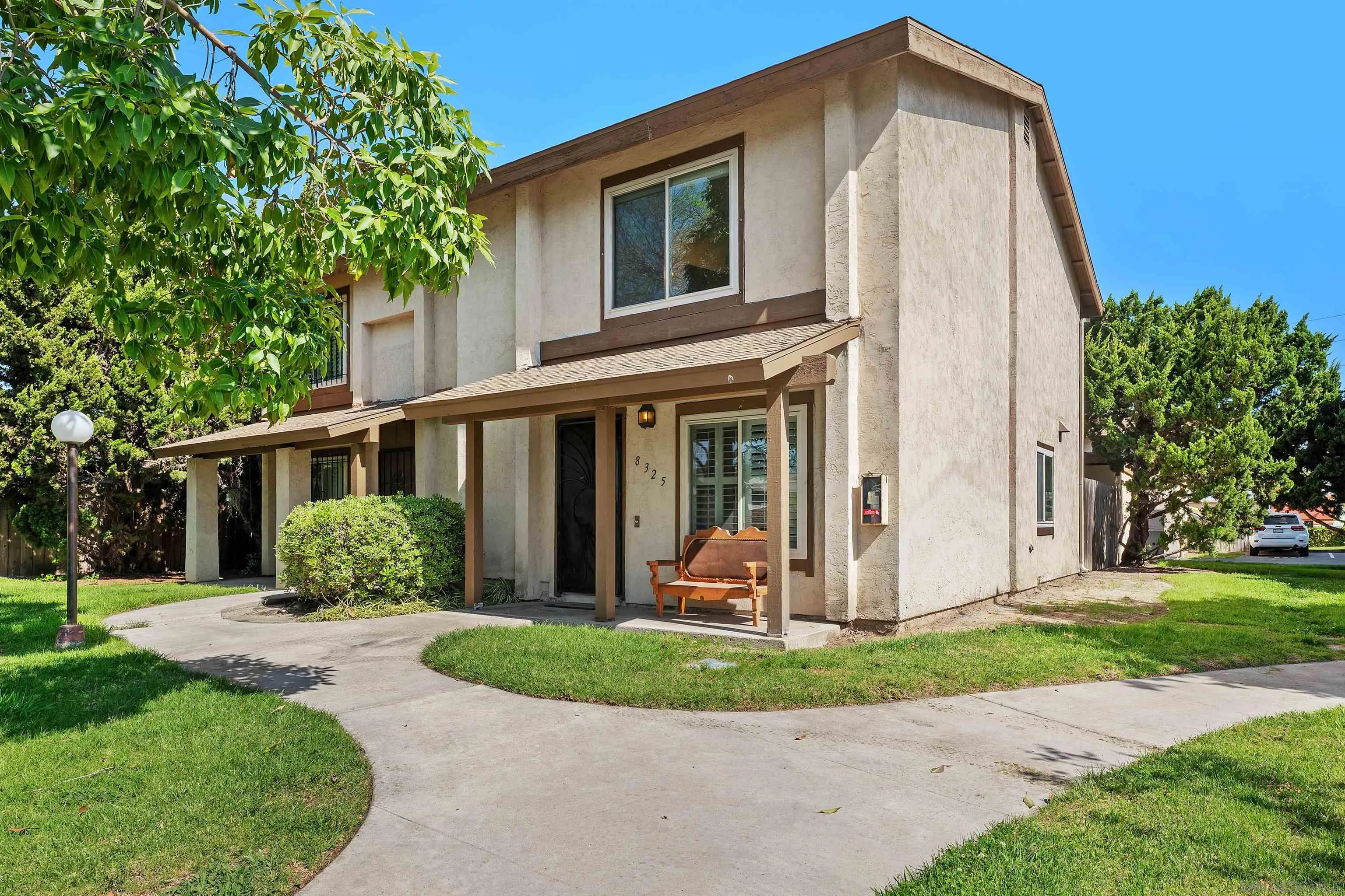 8325 Panorama Ridge Court Spring Valley, CA 91977 - Photo 4 of 39 a front view of a house with a yard