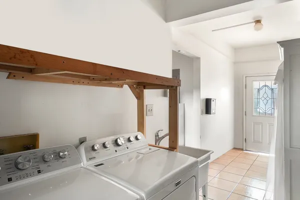 a room with a bed and a dresser