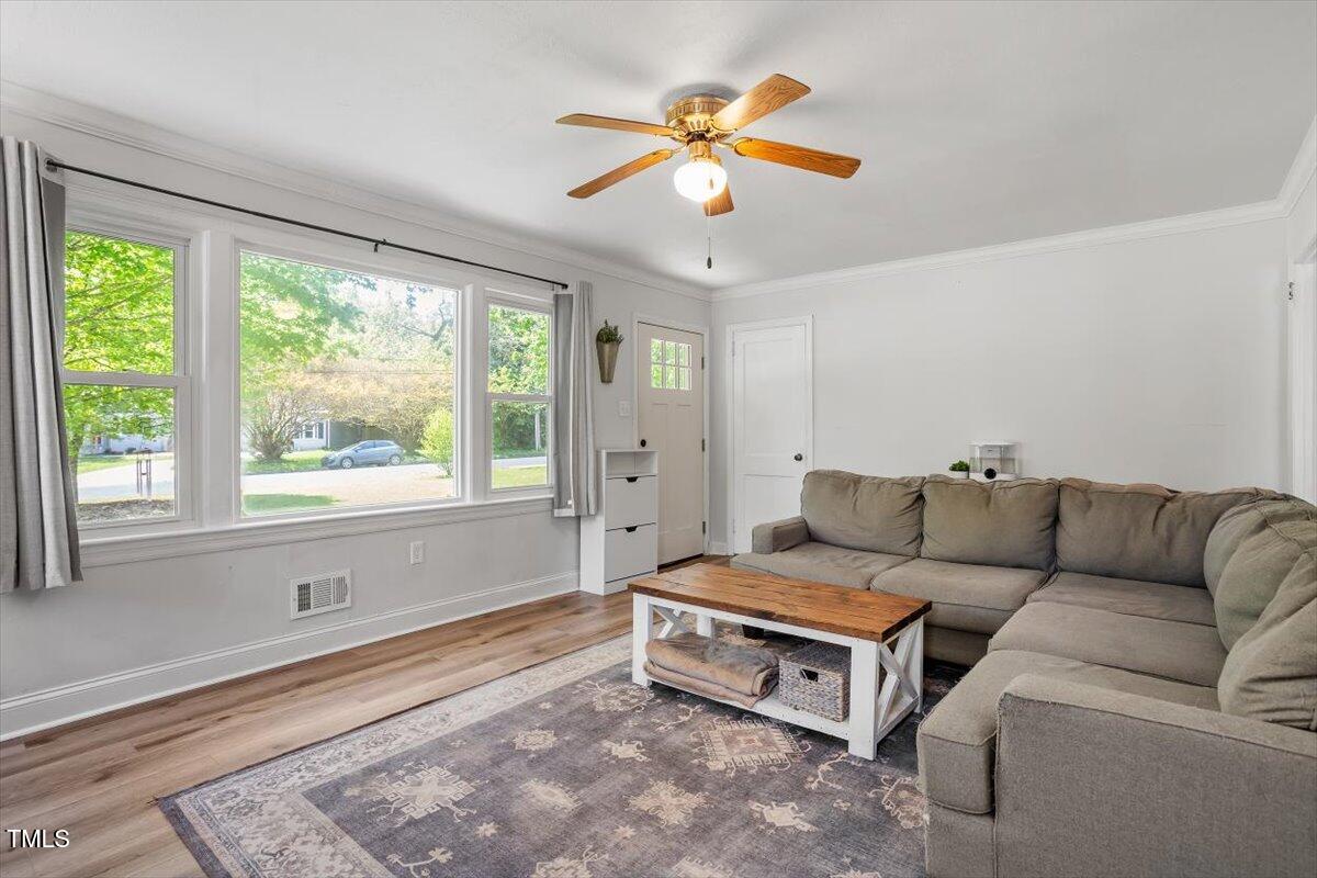 1017 Southerlund Road Garner, NC 27529 - Photo 5 of 26 a living room with furniture and a large window