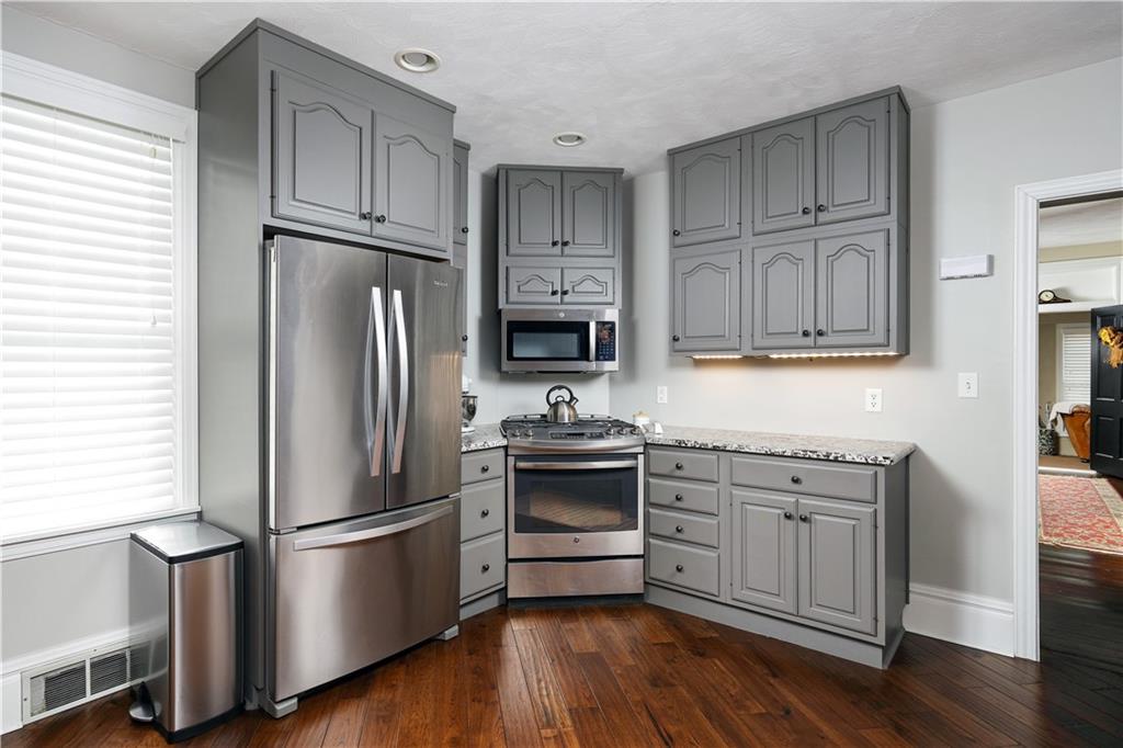 230 West Main Street Ligonier, PA 15658 - Photo 13 of 50 a kitchen with stainless steel appliances a refrigerator stove and sink