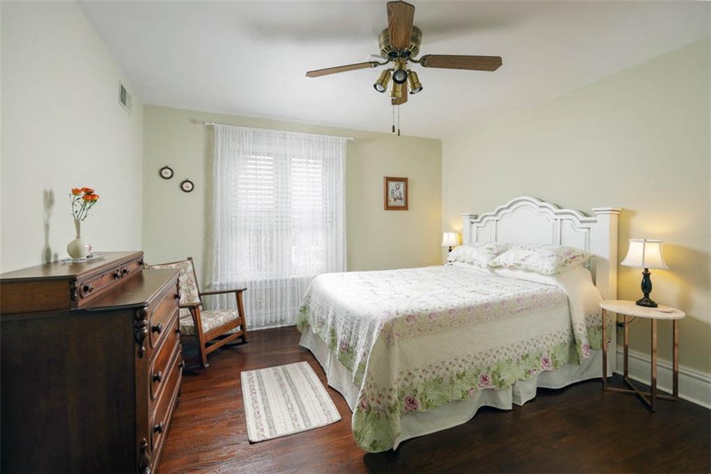 230 West Main Street Ligonier, PA 15658 - Photo 26 of 50 a bedroom with a bed and a chandelier