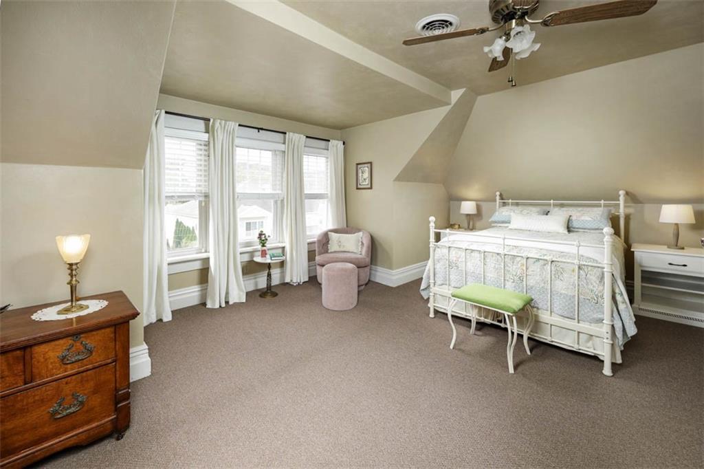 230 West Main Street Ligonier, PA 15658 - Photo 29 of 50 a bedroom with furniture and a chandelier