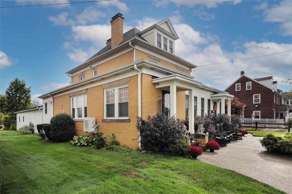 230 West Main Street Ligonier, PA 15658 - Photo 50 of 50 a view of a house with a garden and plants