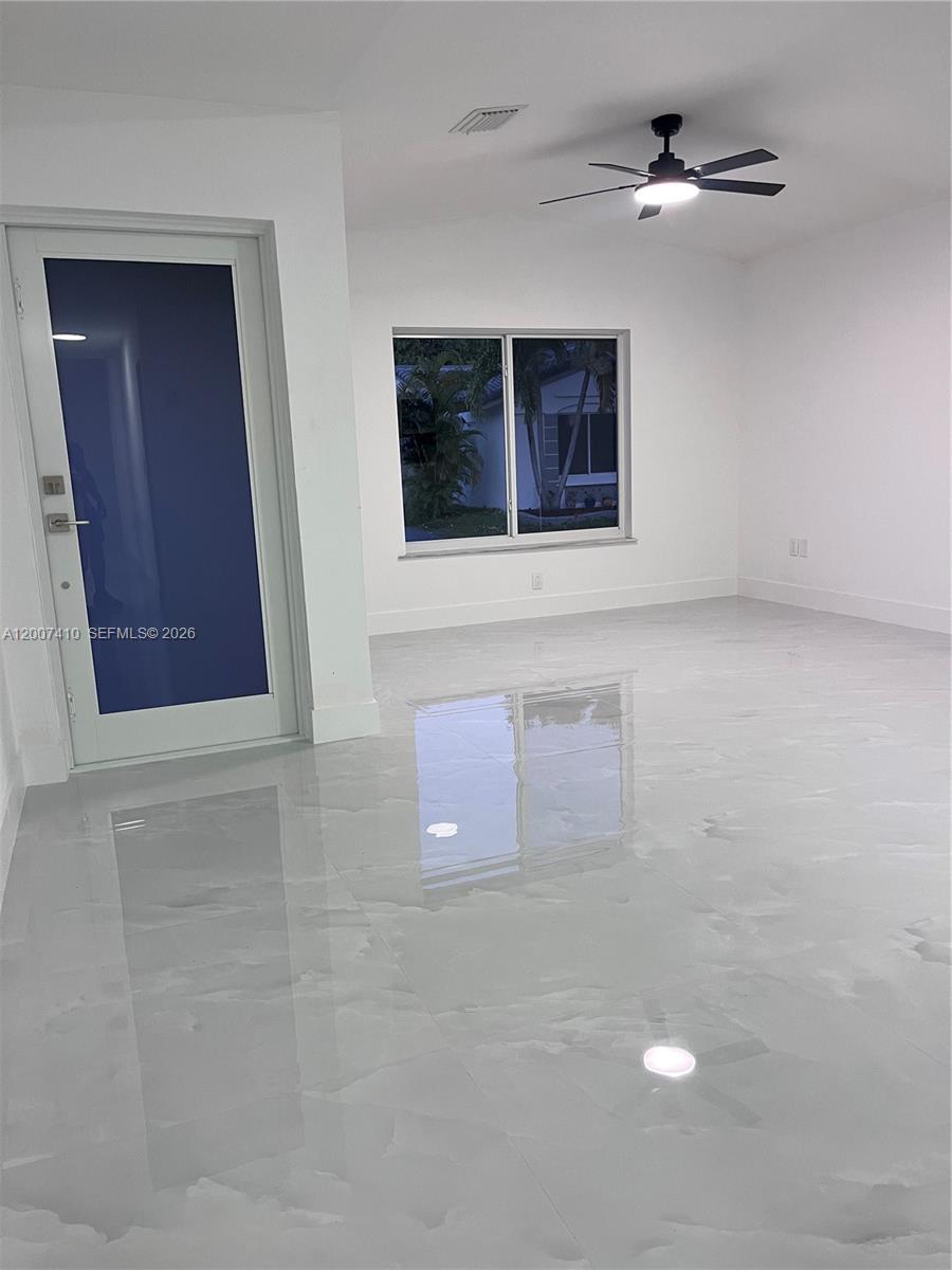 10058 Southwest 156th Court Miami, FL 33196 - Photo 2 of 13 a view of an empty room